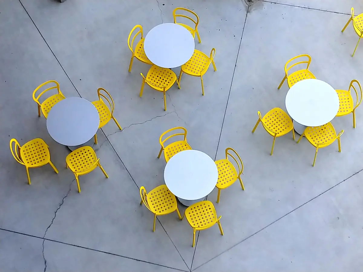 Outdoor furniture on a saw-cut concrete patio slab
