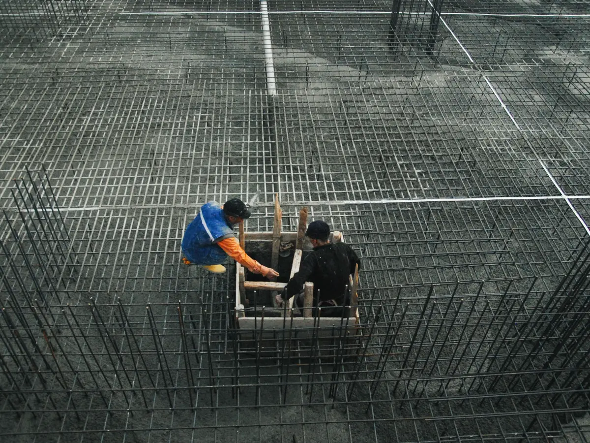 A tied steel reinforcement mat and formwork in place before a concrete slab pour